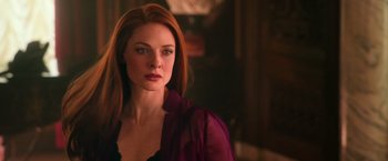 Movie still from “The Greatest Showman” (2017), directed by Michael Gracey – A beautiful woman with red hair wearing a purple shirt; Close Up shot, Over the shoulder angle