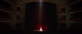 Movie still from “The Greatest Showman” (2017), directed by Michael Gracey – A woman in a white dress on a stage; Extreme Wide shot, Low angle
