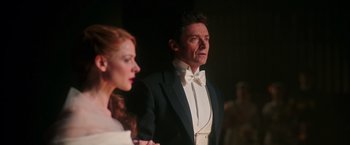 Movie still from “The Greatest Showman” (2017), directed by Michael Gracey – A man and a woman in formal wear standing next to each other; Medium shot, Low angle