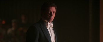 Movie still from “The Greatest Showman” (2017), directed by Michael Gracey – A person wearing a suit and bow tie; Close Up shot, Low angle