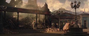 Movie still from “The Greatest Showman” (2017), directed by Michael Gracey – A man standing next to a pile of rubble in a city; Wide shot, Low angle