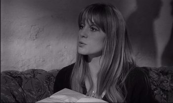 Movie still from “Cul-de-sac” (1966), directed by Roman Polanski – A black and white photo of a woman with long hair; Close Up shot, High angle