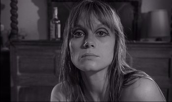 Movie still from “Cul-de-sac” (1966), directed by Roman Polanski – Black and white photograph of a woman looking into the distance; Close Up shot, Low angle