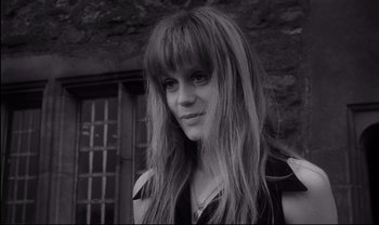 Movie still from “Cul-de-sac” (1966), directed by Roman Polanski – A black and white photo of a woman with long hair; Close Up shot, Low angle