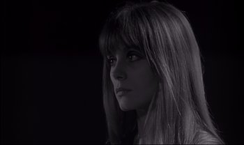 Movie still from “Cul-de-sac” (1966), directed by Roman Polanski – A black and white photo of a woman with long hair; Close Up shot, Low angle
