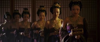 Movie still from “Curse of the Golden Flower” (2006), directed by Yimou Zhang – A group of women dressed in traditional asian clothing; Medium shot, Low angle