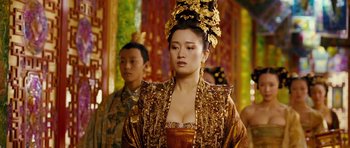Movie still from “Curse of the Golden Flower” (2006), directed by Yimou Zhang – A woman in a gold dress and a man in a red suit; Close Up shot, Over the shoulder angle