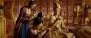 Movie still from “Curse of the Golden Flower” (2006), directed by Yimou Zhang – A group of women dressed in traditional chinese clothing; Medium shot, Low angle