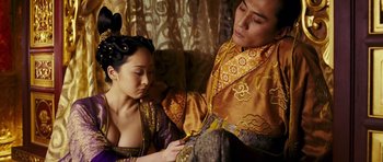 Movie still from “Curse of the Golden Flower” (2006), directed by Yimou Zhang – A man and a woman dressed in oriental garb; Medium shot, High angle