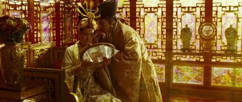 Movie still from “Curse of the Golden Flower” (2006), directed by Yimou Zhang – A man and a woman dressed in traditional chinese garb; Medium shot, Low angle