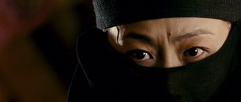 Movie still from “Curse of the Golden Flower” (2006), directed by Yimou Zhang – A person's eyes with a black cloth covering them; Close Up shot, High angle
