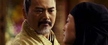 Movie still from “Curse of the Golden Flower” (2006), directed by Yimou Zhang – A man and a woman looking at one another; Close Up shot, Over the shoulder angle
