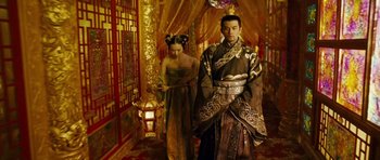 Movie still from “Curse of the Golden Flower” (2006), directed by Yimou Zhang – A man and a woman dressed in traditional chinese clothing; Medium shot, Low angle
