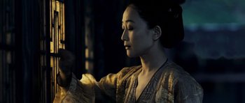 Movie still from “Curse of the Golden Flower” (2006), directed by Yimou Zhang – A beautiful asian woman wearing a kimono looking down; Close Up shot, Low angle