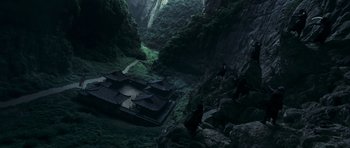 Movie still from “Curse of the Golden Flower” (2006), directed by Yimou Zhang – An aerial view of a building in the middle of a forest; Extreme Wide shot, High angle
