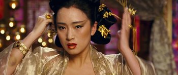 Movie still from “Curse of the Golden Flower” (2006), directed by Yimou Zhang – A person wearing a costume; Close Up shot, Overhead angle