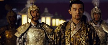 Movie still from “Curse of the Golden Flower” (2006), directed by Yimou Zhang – Two men dressed up in ancient chinese clothing; Medium shot, Over the shoulder angle