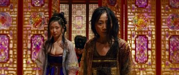 Movie still from “Curse of the Golden Flower” (2006), directed by Yimou Zhang – A group of people standing next to each other in a room; Medium shot, Low angle