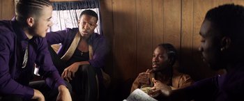 Movie still from “Cut Throat City” (2020), directed by RZA – Two men sitting next to each other in a room; Medium shot, Over the shoulder angle