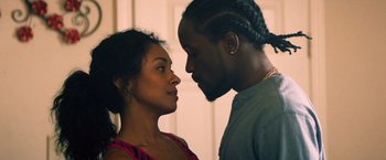 Movie still from “Cut Throat City” (2020), directed by RZA – A man and a woman face to face in front of a door; Close Up shot, Over the shoulder angle