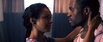 Movie still from “Cut Throat City” (2020), directed by RZA – A man and a woman looking at one another; Close Up shot, Over the shoulder angle