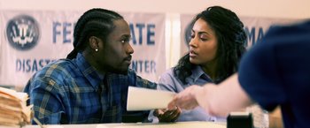 Movie still from “Cut Throat City” (2020), directed by RZA – A man and a woman sitting at a table; Close Up shot, Over the shoulder angle