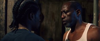 Movie still from “Cut Throat City” (2020), directed by RZA – A man and a woman talking to each other; Close Up shot, Over the shoulder angle