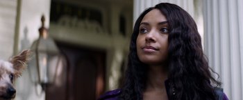 Movie still from “Cut Throat City” (2020), directed by RZA – A person with long black hair; Close Up shot, Low angle