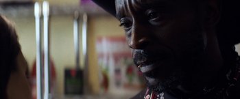 Movie still from “Cut Throat City” (2020), directed by RZA – A person with a cigarette in his mouth; Close Up shot, Over the shoulder angle