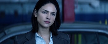 Movie still from “Cut Throat City” (2020), directed by RZA – A person wearing a suit and tie; Close Up shot, Over the shoulder angle