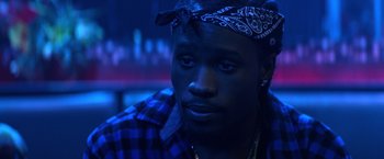 Movie still from “Cut Throat City” (2020), directed by RZA – A person with a bandanna on; Close Up shot, Over the shoulder angle