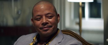 Movie still from “Cut Throat City” (2020), directed by RZA – A man sitting in front of a window with his eyes closed; Close Up shot, Low angle