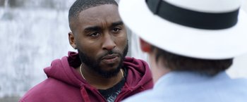 Movie still from “Cut Throat City” (2020), directed by RZA – A person talking to another person; Close Up shot, Over the shoulder angle