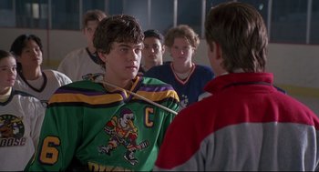 Movie still from “D3: The Mighty Ducks” (1996), directed by Robert Lieberman – A group of young men standing next to each other in a room; Close Up shot, Over the shoulder angle