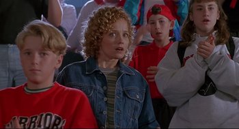 Movie still from “D3: The Mighty Ducks” (1996), directed by Robert Lieberman – A group of people standing in a room; Medium shot, Low angle