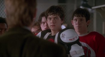 Movie still from “D3: The Mighty Ducks” (1996), directed by Robert Lieberman – A group of young men standing next to each other; Close Up shot, Over the shoulder angle