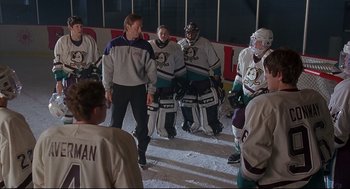 Movie still from “D3: The Mighty Ducks” (1996), directed by Robert Lieberman – A group of hockey players standing in the ice; Wide shot, High angle