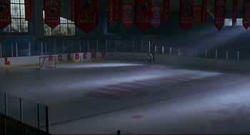 Movie still from “D3: The Mighty Ducks” (1996), directed by Robert Lieberman – An empty ice skating rink at night time; Extreme Wide shot, High angle
