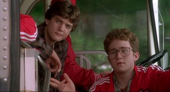 Movie still from “D3: The Mighty Ducks” (1996), directed by Robert Lieberman – Two young men sitting next to each other on a bus; Close Up shot, Low angle