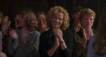 Movie still from “D3: The Mighty Ducks” (1996), directed by Robert Lieberman – A group of people that are sitting in a room together; Medium shot, Over the shoulder angle