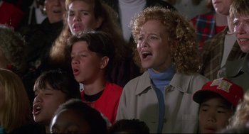 Movie still from “D3: The Mighty Ducks” (1996), directed by Robert Lieberman – A group of people that are sitting in a room; Medium shot, High angle