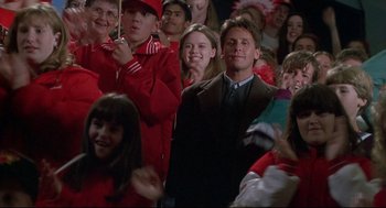 Movie still from “D3: The Mighty Ducks” (1996), directed by Robert Lieberman – A group of people standing in front of a crowd of people; Medium shot, Over the shoulder angle