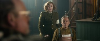 Movie still from “Dad's Army” (2016), directed by Oliver Parker – A woman and a man standing next to each other; Medium shot, Low angle