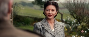 Movie still from “Dad's Army” (2016), directed by Oliver Parker – A woman in a tweed jacket and a white shirt; Close Up shot, Over the shoulder angle