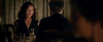 Movie still from “Dad's Army” (2016), directed by Oliver Parker – A man and a woman sitting at a dinner table; Medium shot, Over the shoulder angle