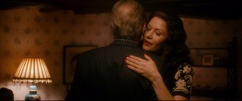 Movie still from “Dad's Army” (2016), directed by Oliver Parker – A man and a woman embracing each other; Close Up shot, Over the shoulder angle