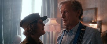 Movie still from “Dad's Army” (2016), directed by Oliver Parker – An older man and a younger woman looking at each other; Medium shot, Over the shoulder angle