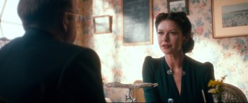 Movie still from “Dad's Army” (2016), directed by Oliver Parker – A woman sitting at a table in front of a mirror; Close Up shot, Over the shoulder angle