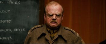Movie still from “Dad's Army” (2016), directed by Oliver Parker – An older man in a military uniform with a mustache; Close Up shot, Over the shoulder angle