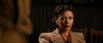 Movie still from “Dad's Army” (2016), directed by Oliver Parker – A person wearing a suit and tie; Close Up shot, Over the shoulder angle